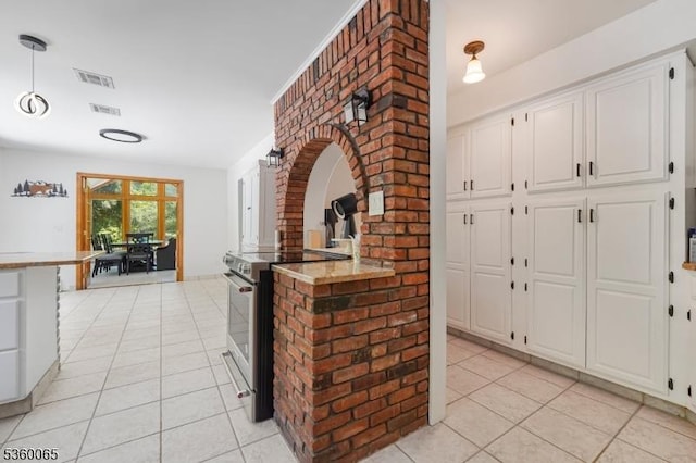 26 Danville Mountain Rd, Liberty Twp, NJ 07838 - kitchen featuring electric stove, light tile patterned floors, white cabinets, and a peninsula