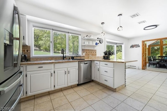 26 Danville Mountain Rd, Liberty Twp, NJ 07838 - kitchen featuring appliances with stainless steel finishes, a sink, white cabinetry, a peninsula, and healthy amount of natural light