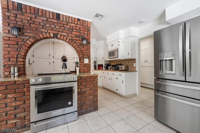 26 Danville Mountain Rd, Liberty Twp, NJ 07838 - kitchen featuring stainless steel appliances, light tile patterned flooring, tasteful backsplash, white cabinets, and a baseboard heating unit