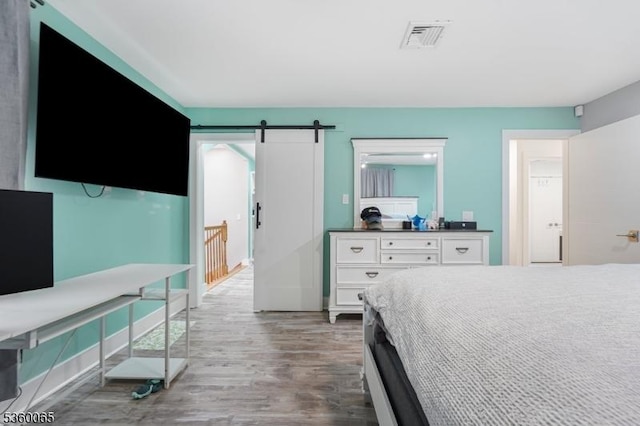 26 Danville Mountain Rd, Liberty Twp, NJ 07838 - bedroom featuring wood finished floors and a barn door