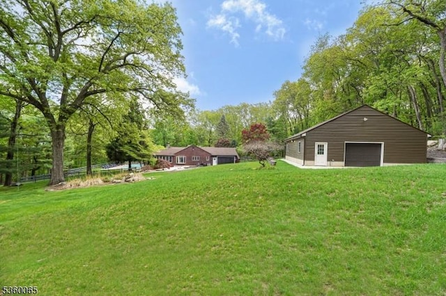 26 Danville Mountain Rd, Liberty Twp, NJ 07838 - view of green lawn featuring a detached garage, an outdoor structure, and view of wooded area
