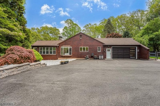 26 Danville Mountain Rd, Liberty Twp, NJ 07838 - view of home's exterior featuring driveway, a garage, and view of scattered trees