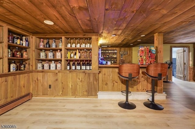 26 Danville Mountain Rd, Liberty Twp, NJ 07838 - indoor dry bar with wood ceiling, a baseboard heating unit, wood finished floors, and wooden walls