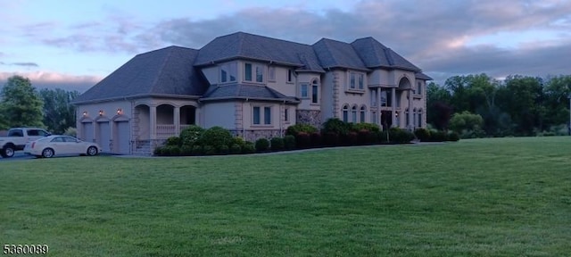 2 Kristina Way, Raritan Twp, NJ 08822 - view of front of house with a yard, a garage, and stone siding