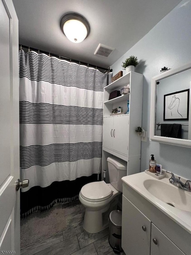 85 Tillinghast St, Newark City, NJ 07108 - bathroom with vanity, toilet, and curtained shower