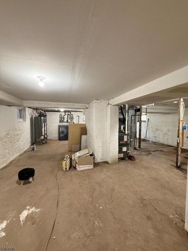 85 Tillinghast St, Newark City, NJ 07108 - unfinished below grade area featuring water heater and heating unit