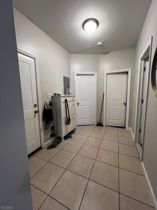 85 Tillinghast St, Newark City, NJ 07108 - laundry room with light tile patterned floors and baseboards