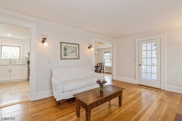 405 High St, Cranford Twp, NJ 07016 - living area with baseboards, light wood-type flooring, and crown molding