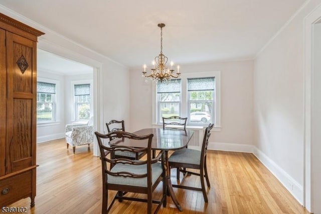 405 High St, Cranford Twp, NJ 07016 - dining space featuring plenty of natural light, light wood-style flooring, baseboards, and crown molding