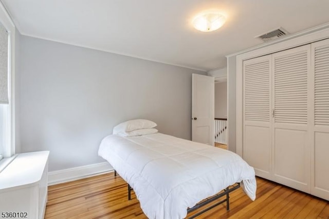 405 High St, Cranford Twp, NJ 07016 - bedroom featuring light wood-style floors, a closet, and baseboards
