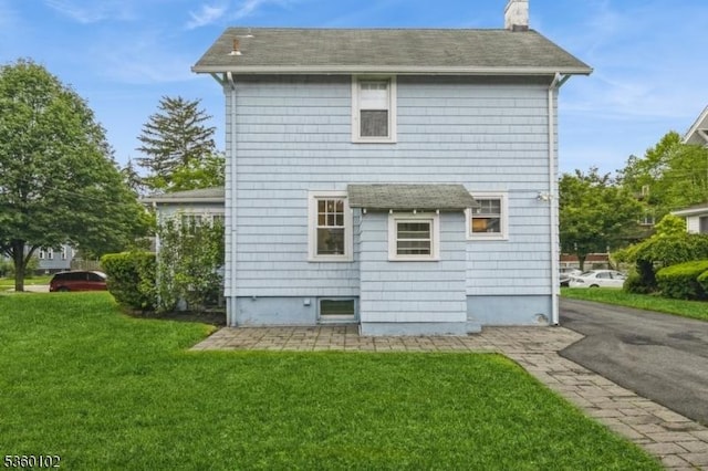 405 High St, Cranford Twp, NJ 07016 - rear view of property featuring a yard, a chimney, and a shingled roof