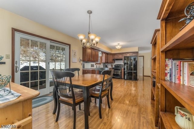 249 Good Springs Rd, Franklin Twp, NJ 08886 - dining room with a chandelier and light wood-type flooring