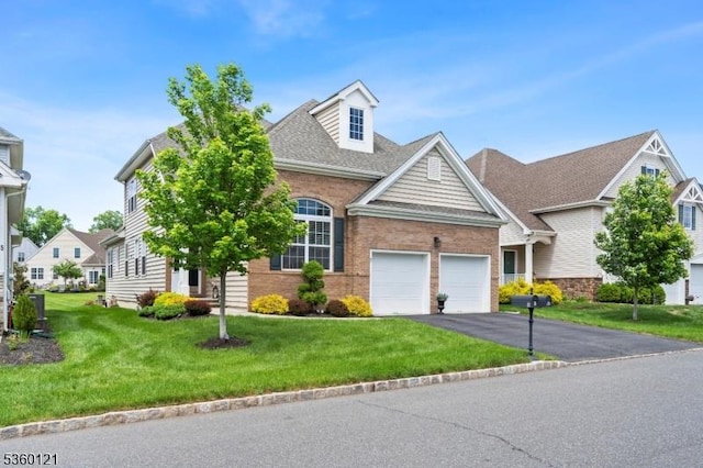 7 Bryant Ct, Franklin Twp, NJ 08873 - traditional home with asphalt driveway, an attached garage, a front lawn, and brick siding