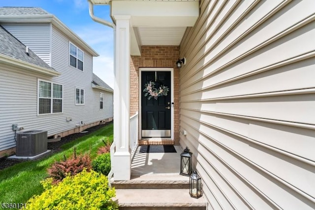 7 Bryant Ct, Franklin Twp, NJ 08873 - doorway to property with central air condition unit and brick siding
