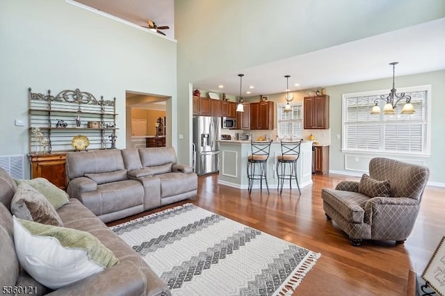 7 Bryant Ct, Franklin Twp, NJ 08873 - living room featuring a chandelier, wood finished floors, a ceiling fan, baseboards, and recessed lighting