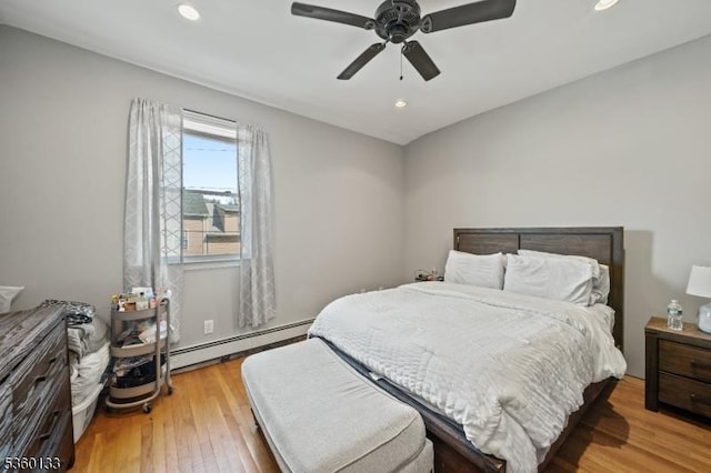 100 N 8th St, Paterson City, NJ 07522 - bedroom featuring baseboard heating, wood finished floors, recessed lighting, and a ceiling fan