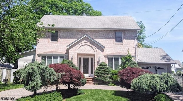 81 Wilder St, Hillside Twp, NJ 07205 - view of front of house featuring brick siding and a garage