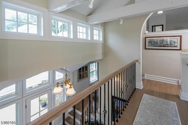 760 Rosemont Ringoes Rd, Delaware Twp, NJ 08559 - corridor with track lighting, wood finished floors, high vaulted ceiling, an upstairs landing, and arched walkways