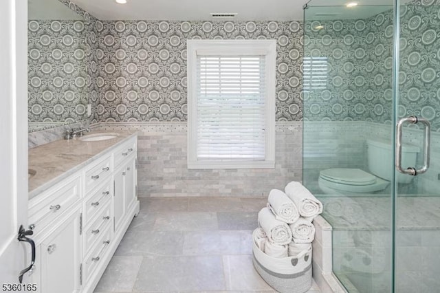 760 Rosemont Ringoes Rd, Delaware Twp, NJ 08559 - bathroom featuring tile walls, double vanity, wallpapered walls, a tile shower, and a wainscoted wall