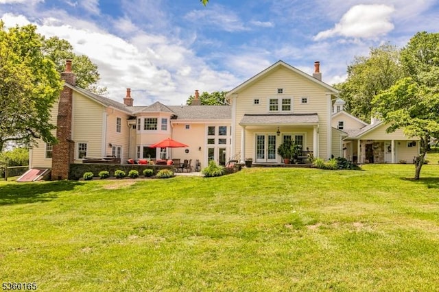 760 Rosemont Ringoes Rd, Delaware Twp, NJ 08559 - back of property with french doors, a yard, a patio area, and a chimney