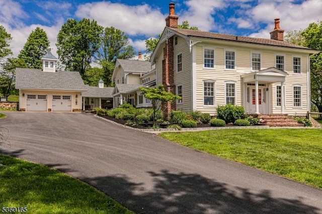 760 Rosemont Ringoes Rd, Delaware Twp, NJ 08559 - colonial house featuring a chimney, asphalt driveway, a front lawn, and a garage