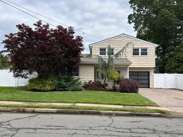 20 Wick Dr, Woodbridge Twp, NJ 08863 - view of front facade featuring decorative driveway and a garage