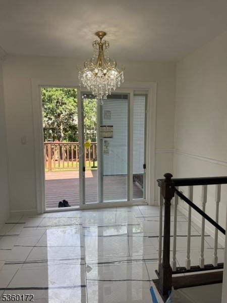 20 Wick Dr, Woodbridge Twp, NJ 08863 - doorway to outside with a chandelier and tile patterned floors