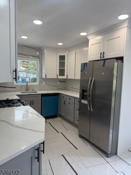 20 Wick Dr, Woodbridge Twp, NJ 08863 - kitchen with stainless steel fridge, dishwashing machine, a sink, backsplash, and light stone counters