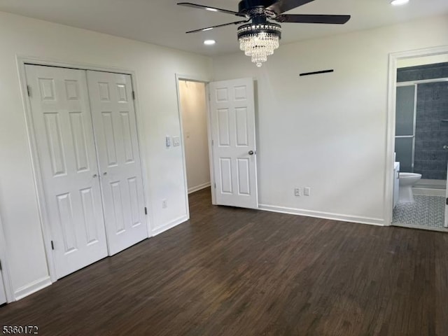 20 Wick Dr, Woodbridge Twp, NJ 08863 - unfurnished bedroom featuring dark wood-style flooring, baseboards, a closet, connected bathroom, and recessed lighting