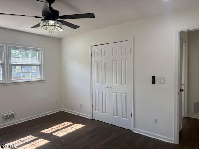 20 Wick Dr, Woodbridge Twp, NJ 08863 - unfurnished bedroom with dark wood finished floors, baseboards, a closet, and a ceiling fan