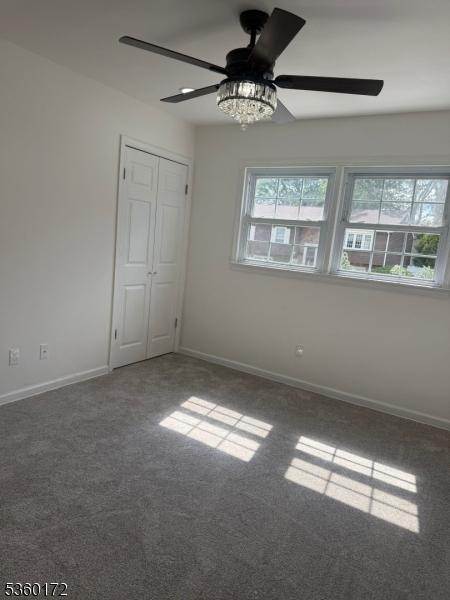 20 Wick Dr, Woodbridge Twp, NJ 08863 - unfurnished room with carpet, a ceiling fan, and baseboards