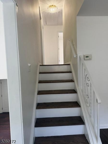 20 Wick Dr, Woodbridge Twp, NJ 08863 - stairway featuring attic access, wood finished floors, and baseboards