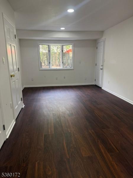 20 Wick Dr, Woodbridge Twp, NJ 08863 - spare room featuring dark wood-style flooring, baseboards, and recessed lighting