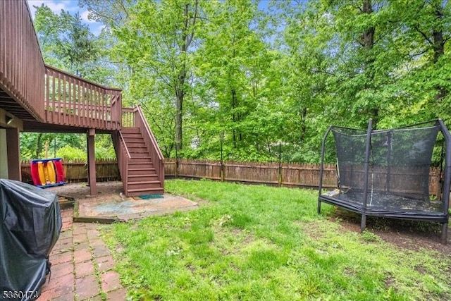 4 Alfred Way, Hopatcong Boro, NJ 07843 - view of yard featuring a trampoline, stairway, and a wooden deck