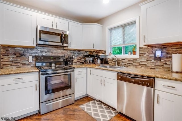 4 Alfred Way, Hopatcong Boro, NJ 07843 - kitchen with stainless steel appliances, a sink, white cabinetry, and backsplash