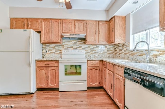 11 B Greenwood Ln Unit Sec62, Manchester Twp, NJ 08759 - kitchen with white appliances, under cabinet range hood, a sink, backsplash, and light stone countertops