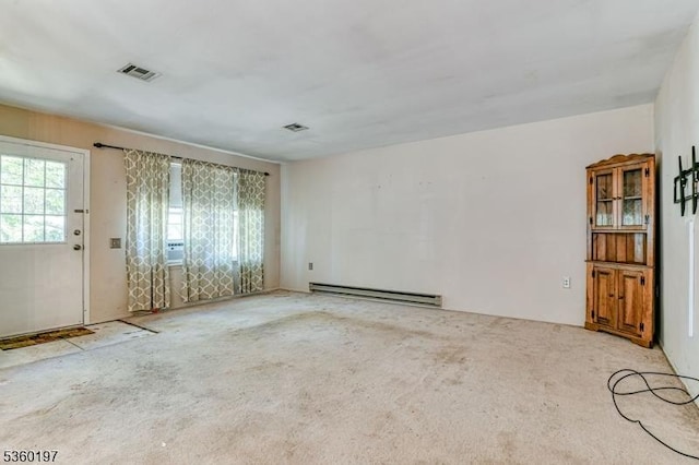 11 B Greenwood Ln Unit Sec62, Manchester Twp, NJ 08759 - empty room featuring a baseboard heating unit and carpet floors
