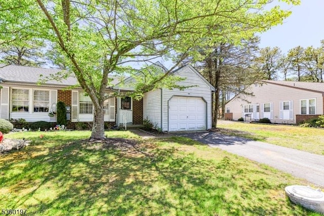 11 B Greenwood Ln Unit Sec62, Manchester Twp, NJ 08759 - ranch-style house with asphalt driveway, a front lawn, brick siding, and a garage