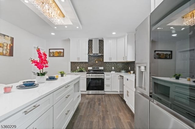 254 Springfield Ave, Rutherford Boro, NJ 07070 - kitchen with stainless steel appliances, wall chimney range hood, a chandelier, recessed lighting, and light countertops
