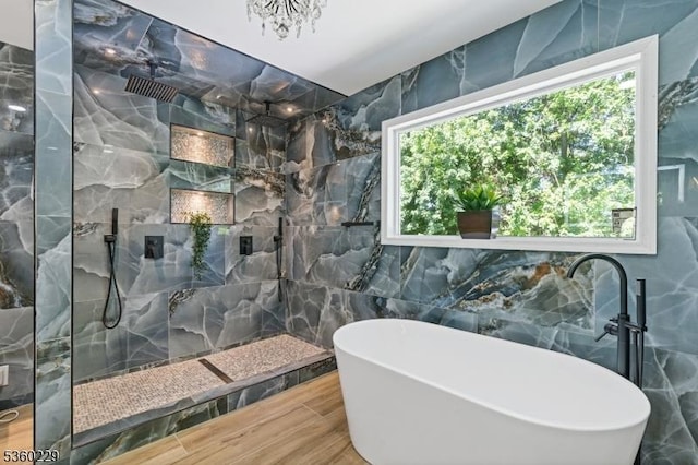 254 Springfield Ave, Rutherford Boro, NJ 07070 - full bathroom featuring tile walls, a freestanding tub, wood finished floors, a marble finish shower, and a chandelier