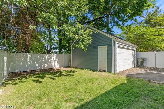 254 Springfield Ave, Rutherford Boro, NJ 07070 - view of yard featuring an outdoor structure, asphalt driveway, and a detached garage