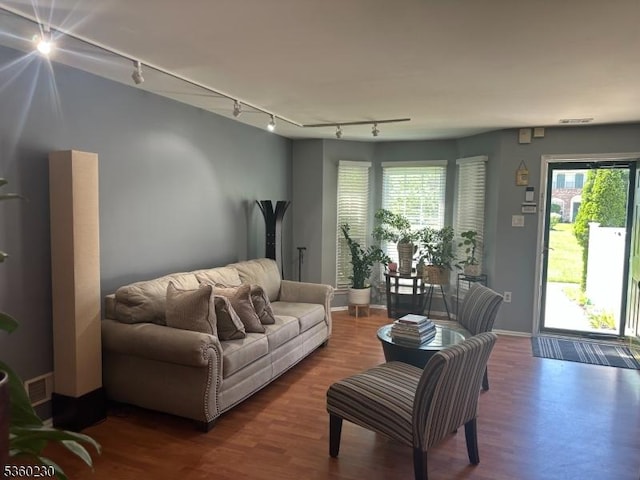 8 Bristol Dr, North Brunswick Twp, NJ 08902 - living area featuring rail lighting, baseboards, and wood finished floors