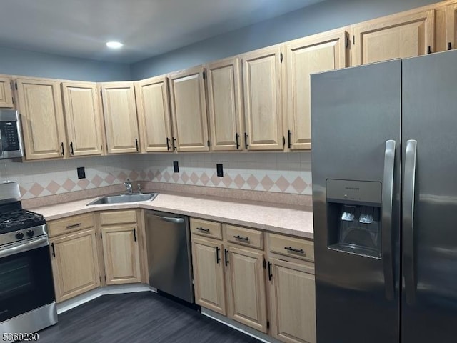 8 Bristol Dr, North Brunswick Twp, NJ 08902 - kitchen featuring stainless steel appliances, a sink, light countertops, light brown cabinetry, and backsplash