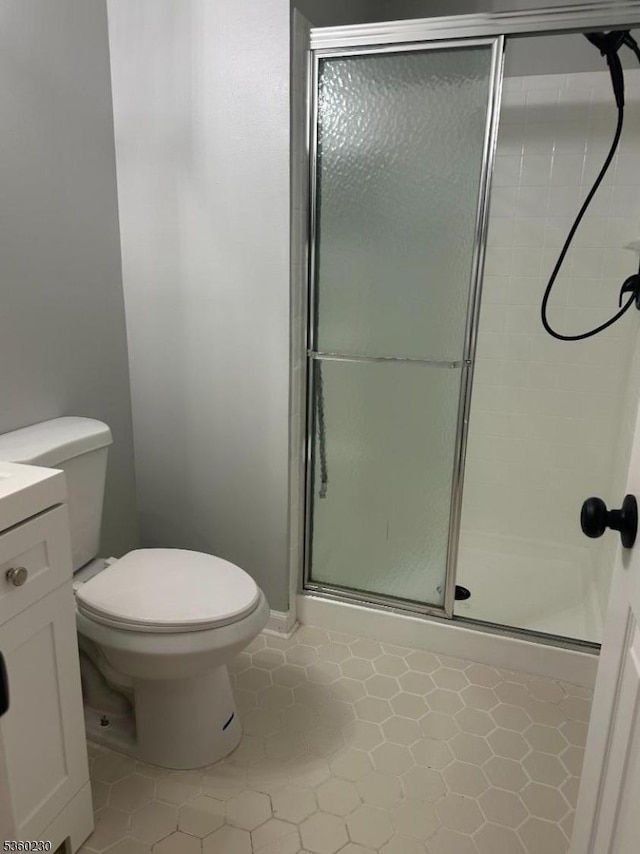8 Bristol Dr, North Brunswick Twp, NJ 08902 - full bathroom featuring a stall shower, toilet, vanity, and tile patterned floors