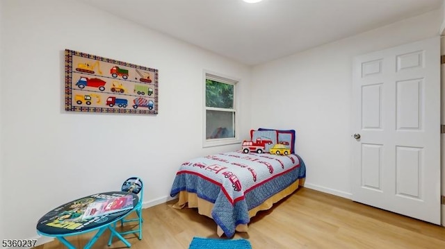 13 Prospect St, Metuchen Boro, NJ 08840 - bedroom with wood finished floors and baseboards