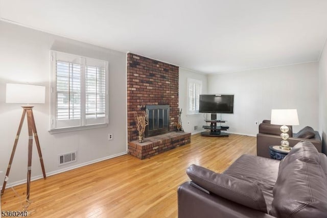 712 Kaminski Dr, Rahway City, NJ 07065 - living room featuring plenty of natural light, wood finished floors, baseboards, and a fireplace