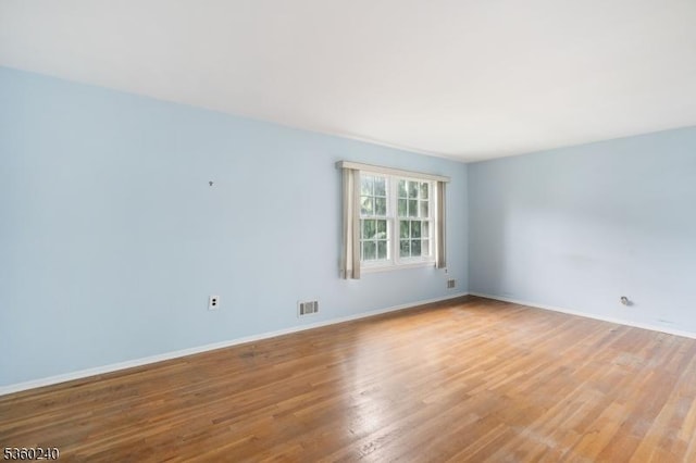 712 Kaminski Dr, Rahway City, NJ 07065 - spare room with wood finished floors and baseboards