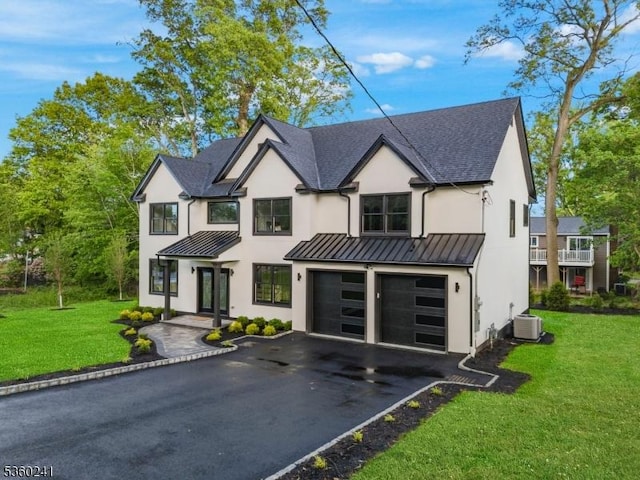 10 Wilson Ave, Wayne Twp, NJ 07470 - view of front of home with a standing seam roof, driveway, a garage, and central AC unit