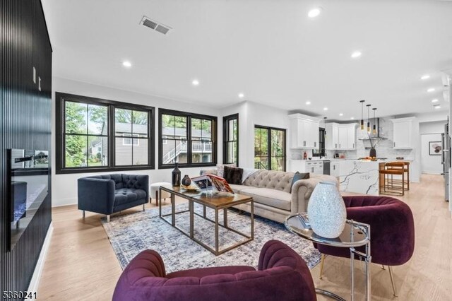 10 Wilson Ave, Wayne Twp, NJ 07470 - living area featuring recessed lighting, light wood finished floors, and baseboards
