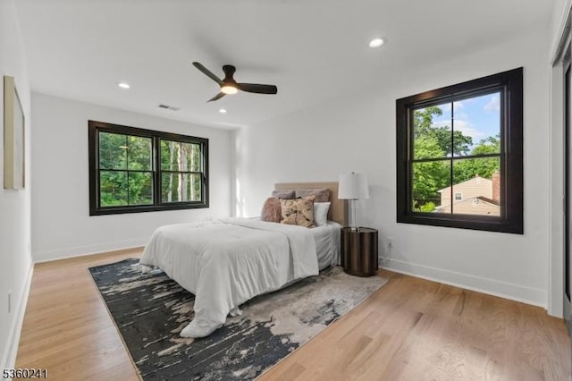 10 Wilson Ave, Wayne Twp, NJ 07470 - bedroom with multiple windows, wood finished floors, baseboards, recessed lighting, and a ceiling fan